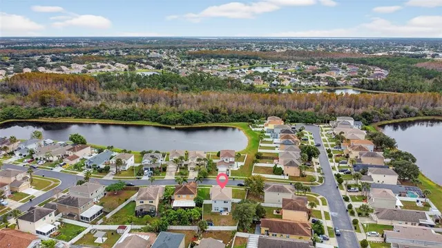 an aerial view of city and lake