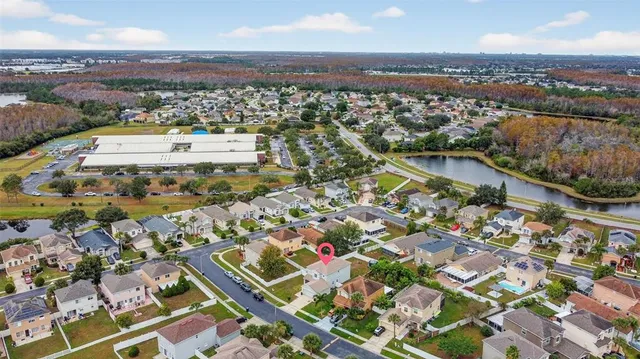 an aerial view of residential houses with outdoor space