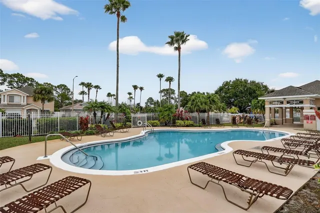 a view of a swimming pool with a patio