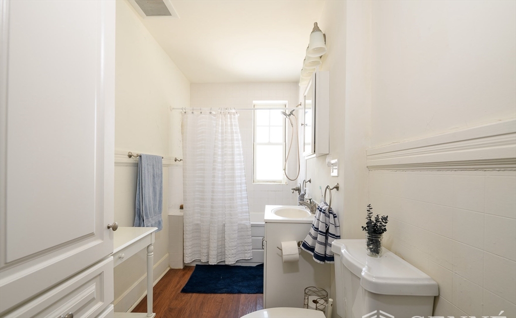 55 Magazine Street, Unit 23 Cambridge, MA 02139 - Photo 6 of 14 a bathroom with a sink a toilet and a shower