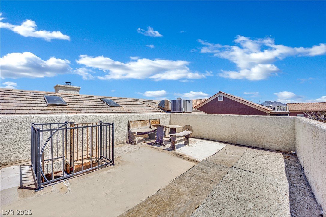 420 North Racetrack Road Henderson, NV 89015 - Photo 48 of 52 Enjoy desert vistas and sun-drenched moments from this spacious rooftop deck, perfect for leisure.