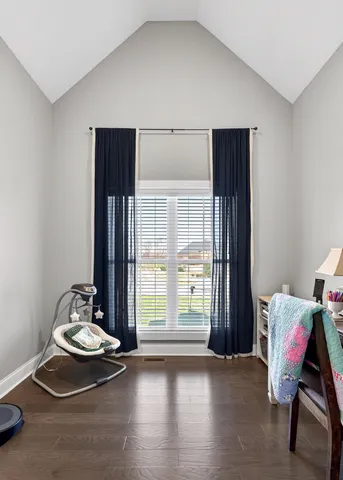 a room with a window and couch