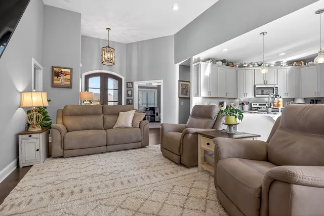 a living room with furniture and a potted plant