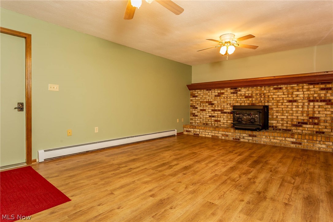 5248 Case Road North Ridgeville, OH 44039 - Photo 10 of 29 Family room with wood burner
