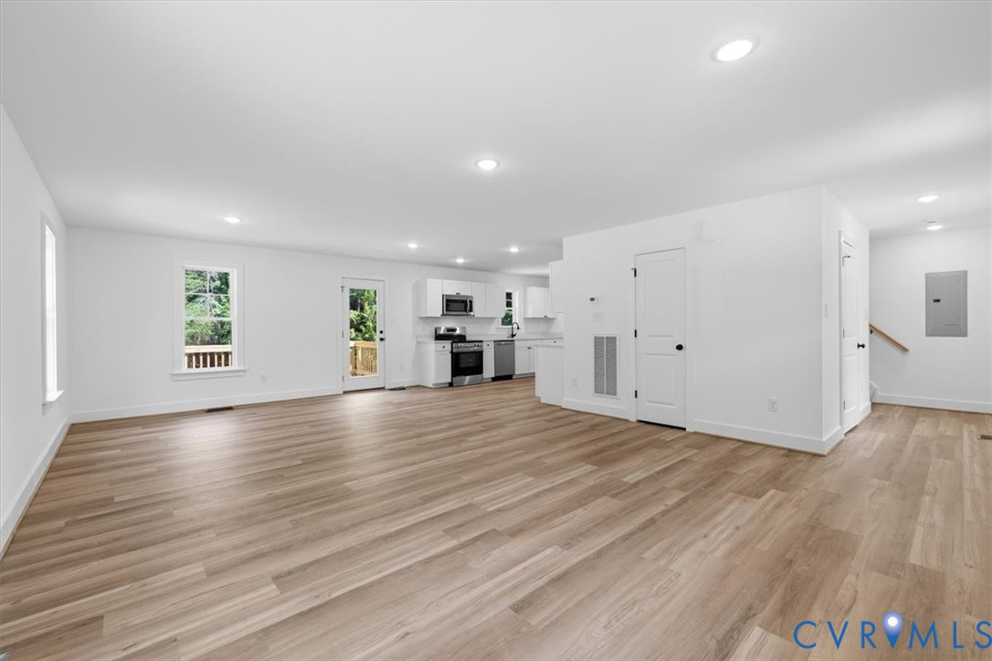 654 Frenchs Store Road Cumberland, VA 23040 - Photo 4 of 24 Spacious open-concept living area featuring wood-f