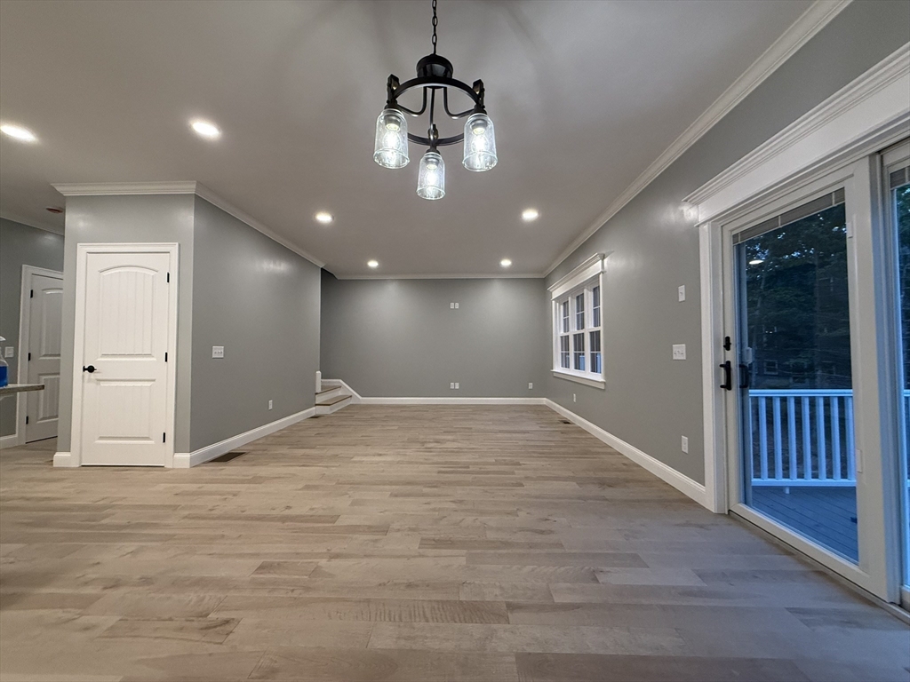 24 Cooper Road Webster, MA 01570 - Photo 14 of 42 a view of an empty room with wooden floor and a window