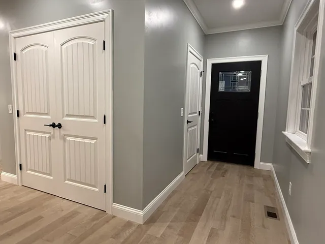 a bathroom with a toilet a sink and a mirror