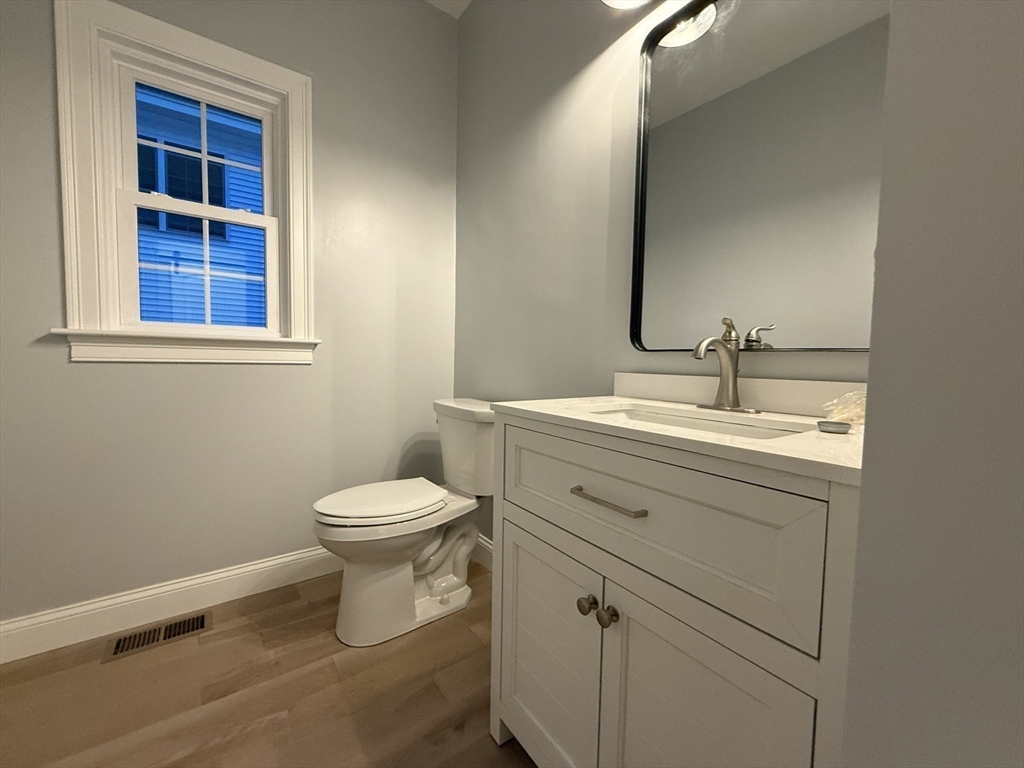 24 Cooper Road Webster, MA 01570 - Photo 19 of 42 a bathroom with a toilet a sink and a mirror