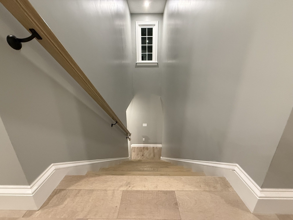 24 Cooper Road Webster, MA 01570 - Photo 21 of 42 a view of a hallway with staircase