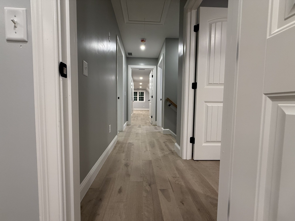 24 Cooper Road Webster, MA 01570 - Photo 22 of 42 a view of hallway with wooden floor