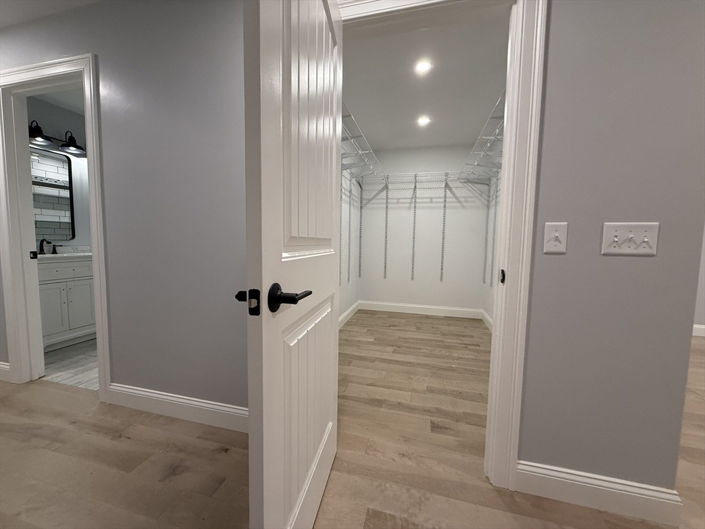 24 Cooper Road Webster, MA 01570 - Photo 27 of 42 wooden floor with view of bathroom