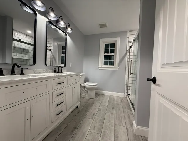 a view of an entryway with wooden floor