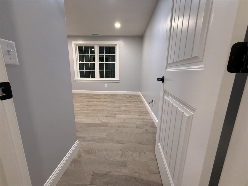 24 Cooper Road Webster, MA 01570 - Photo 32 of 42 a view of an entryway with wooden floor