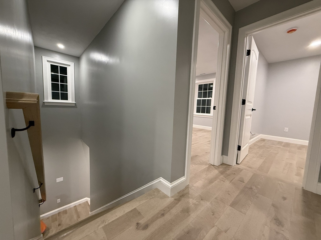 24 Cooper Road Webster, MA 01570 - Photo 34 of 42 a view of a hallway with windows and entryway