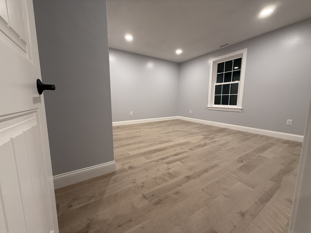 24 Cooper Road Webster, MA 01570 - Photo 35 of 42 a view of an empty room with a window