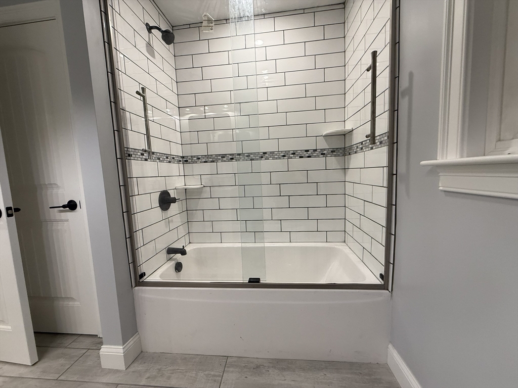 24 Cooper Road Webster, MA 01570 - Photo 39 of 42 a bathroom with bathtub and shower