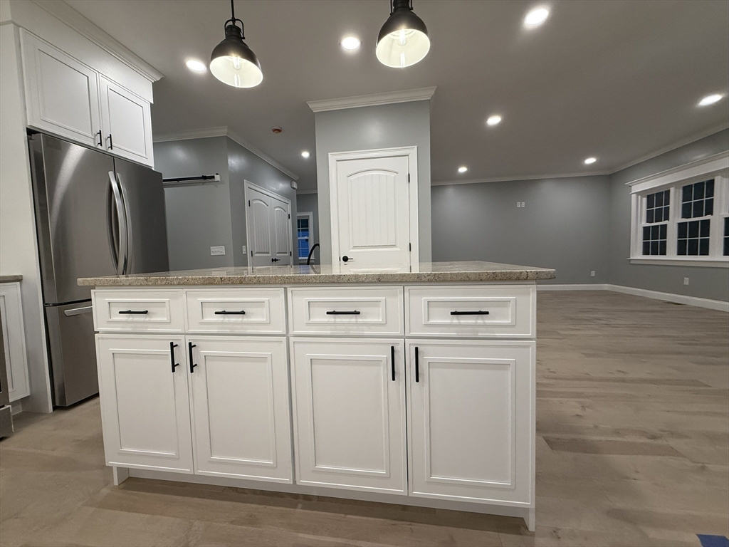 24 Cooper Road Webster, MA 01570 - Photo 6 of 42 a kitchen with white cabinets and refrigerator