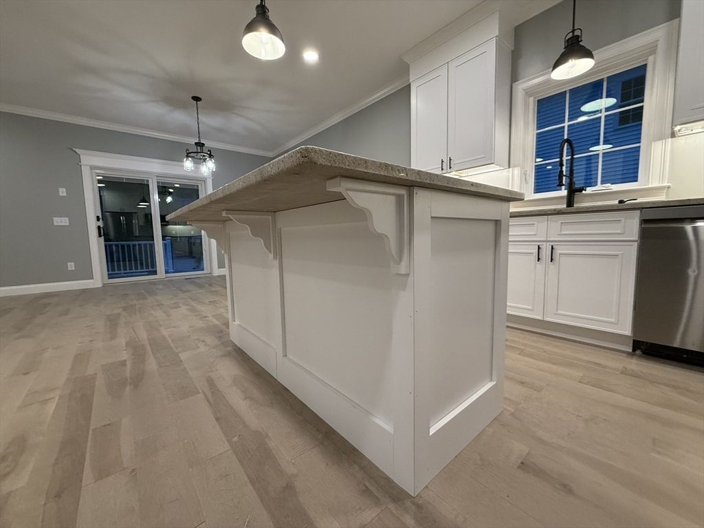 24 Cooper Road Webster, MA 01570 - Photo 10 of 42 a view of kitchen with cabinets and wooden floor