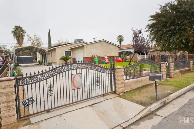 a view of a park with iron fence