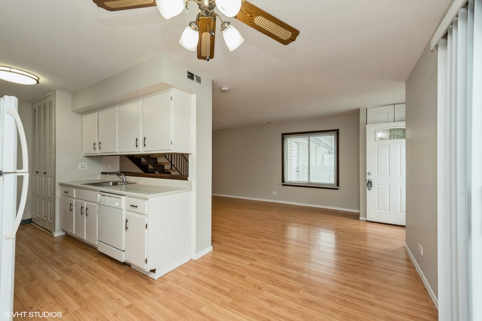 1560 Cornell Circle, Unit 31A Hoffman Estates, IL 60169 - Photo 6 of 12 a kitchen with stainless steel appliances granite countertop a stove a sink and a refrigerator
