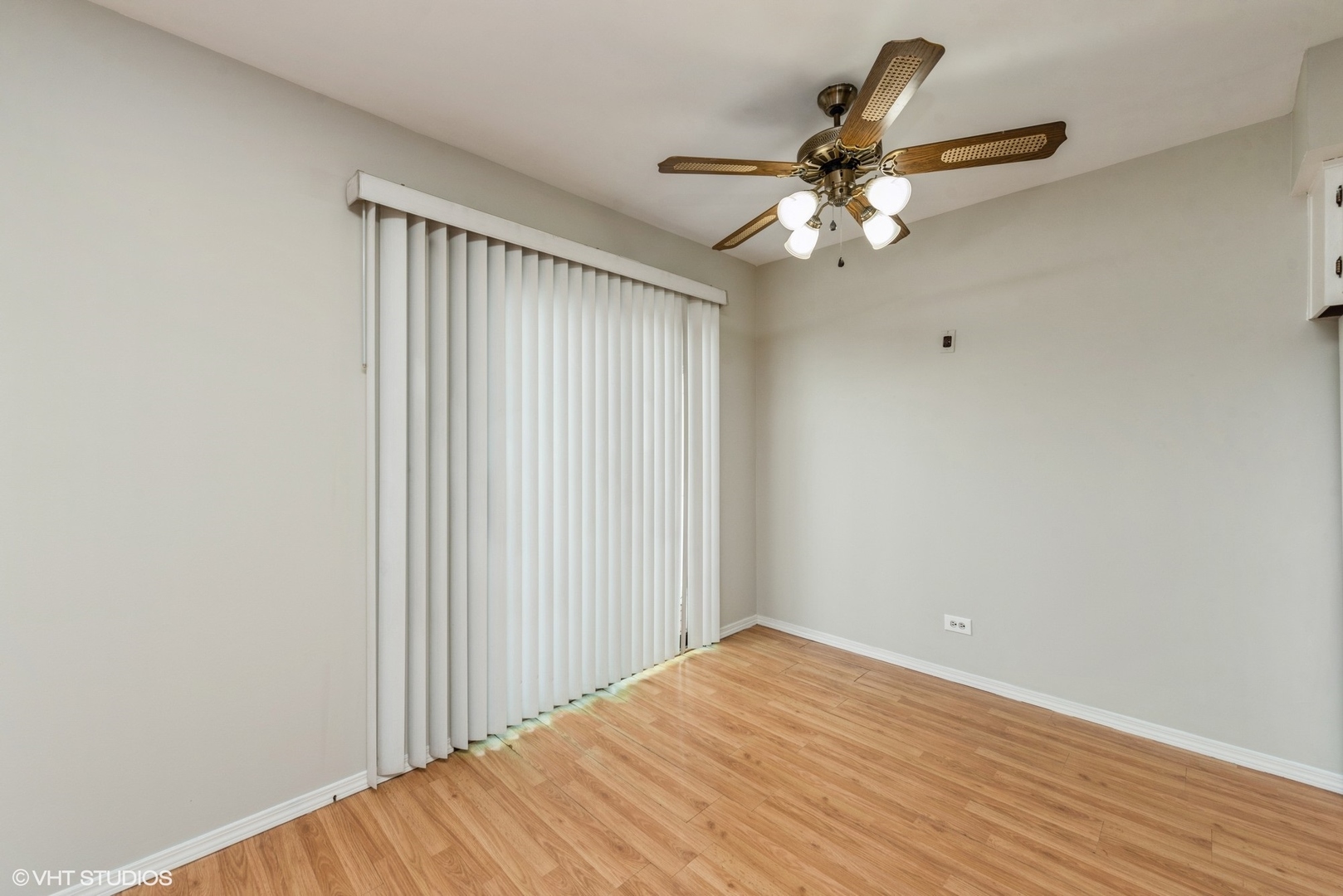 1560 Cornell Circle, Unit 31A Hoffman Estates, IL 60169 - Photo 7 of 12 a view of a livingroom with a ceiling fan and wooden floor