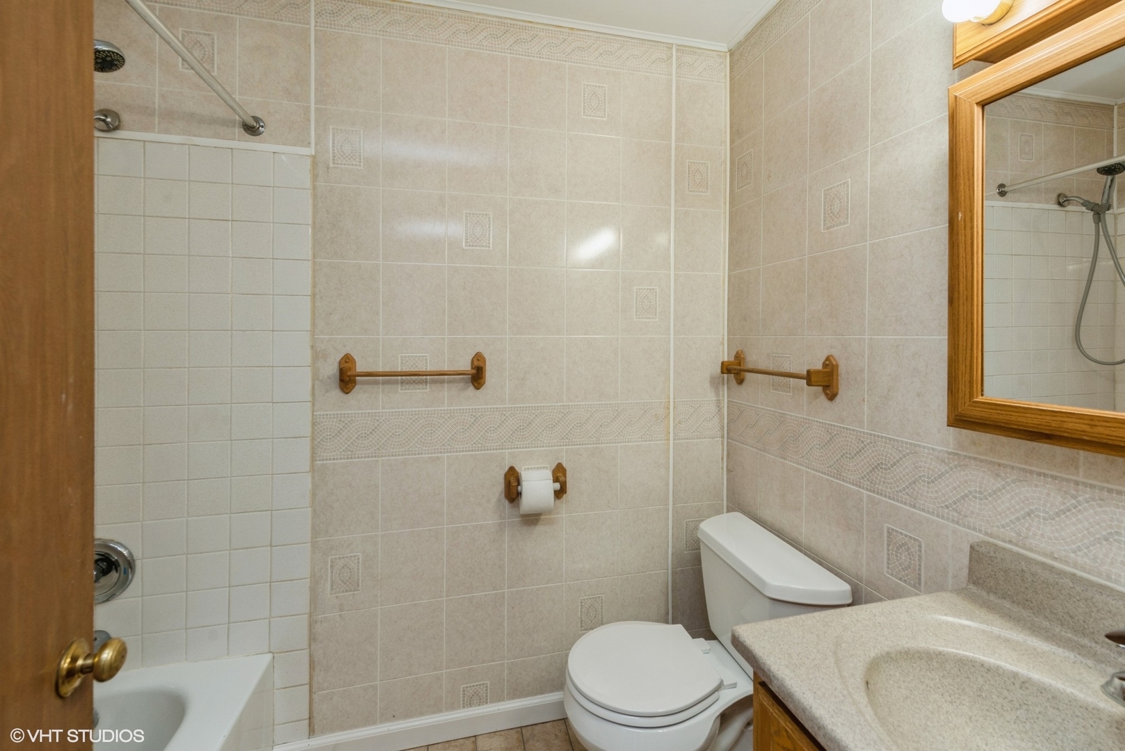 1560 Cornell Circle, Unit 31A Hoffman Estates, IL 60169 - Photo 10 of 12 a white toilet and shower in a bathroom