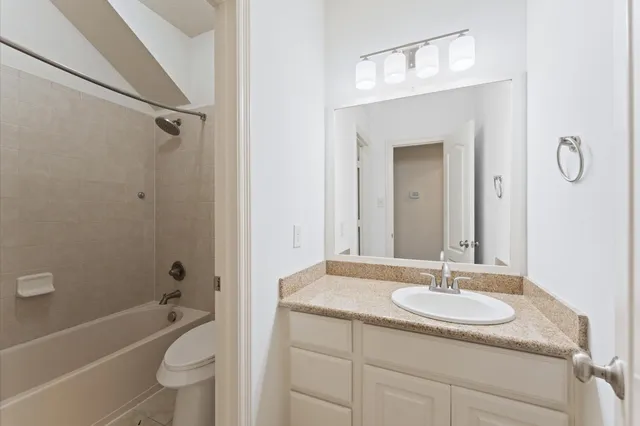 a bathroom with a sink toilet a shower and a mirror