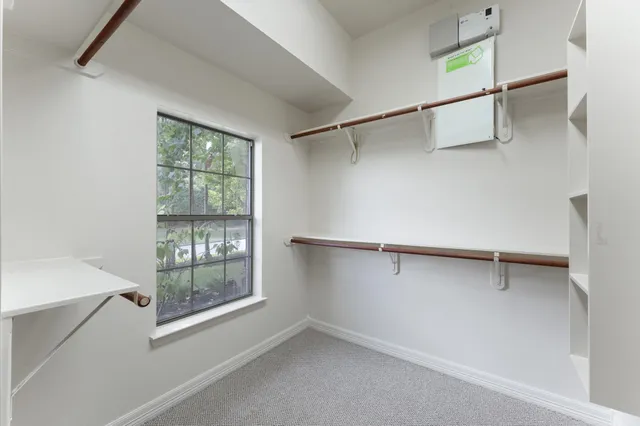 a view of an empty walk in closet