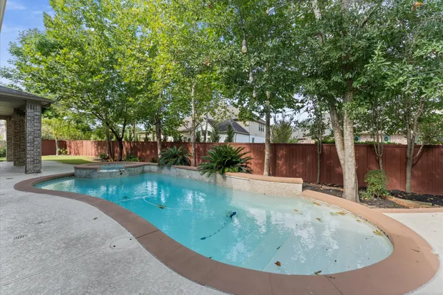 a view of a swimming pool with a sitting area