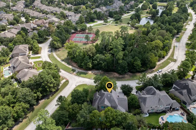 an aerial view of a house with a garden