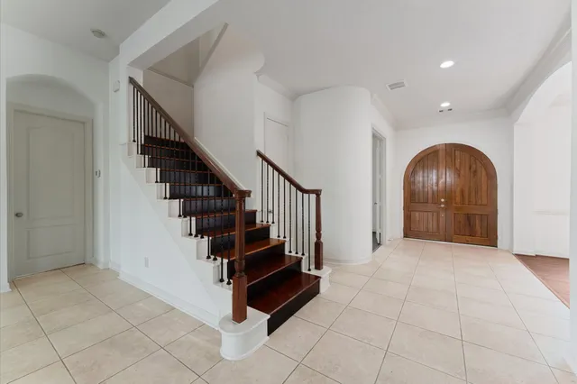 a view of entryway with stairs and wooden floor