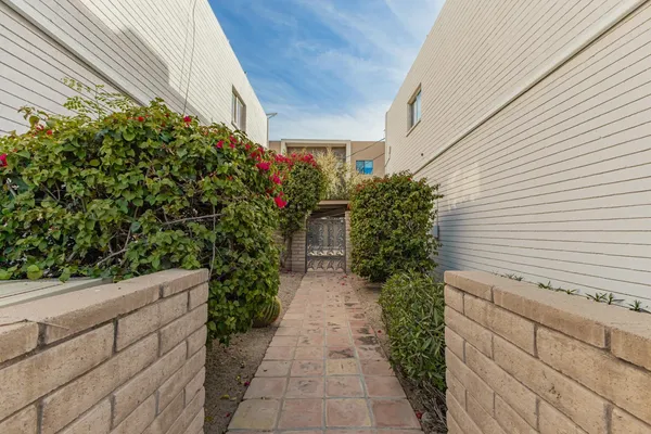 a view of a pathway with a house