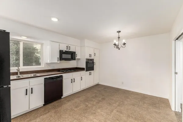 a large kitchen with cabinets