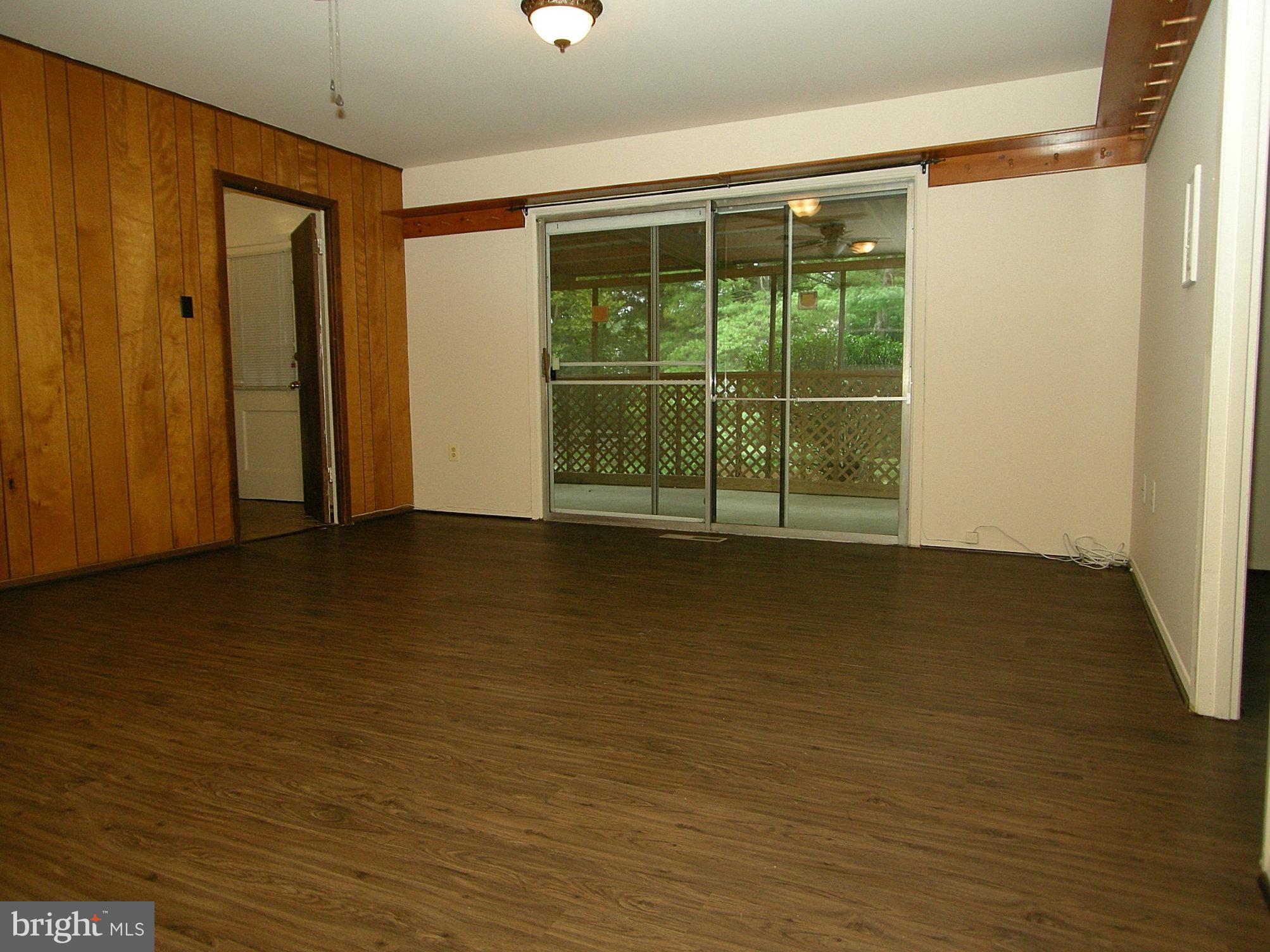 12800 Silverbirch Lane Laurel, MD 20708 - Photo 14 of 22 Family room with sliders leading to screened porch