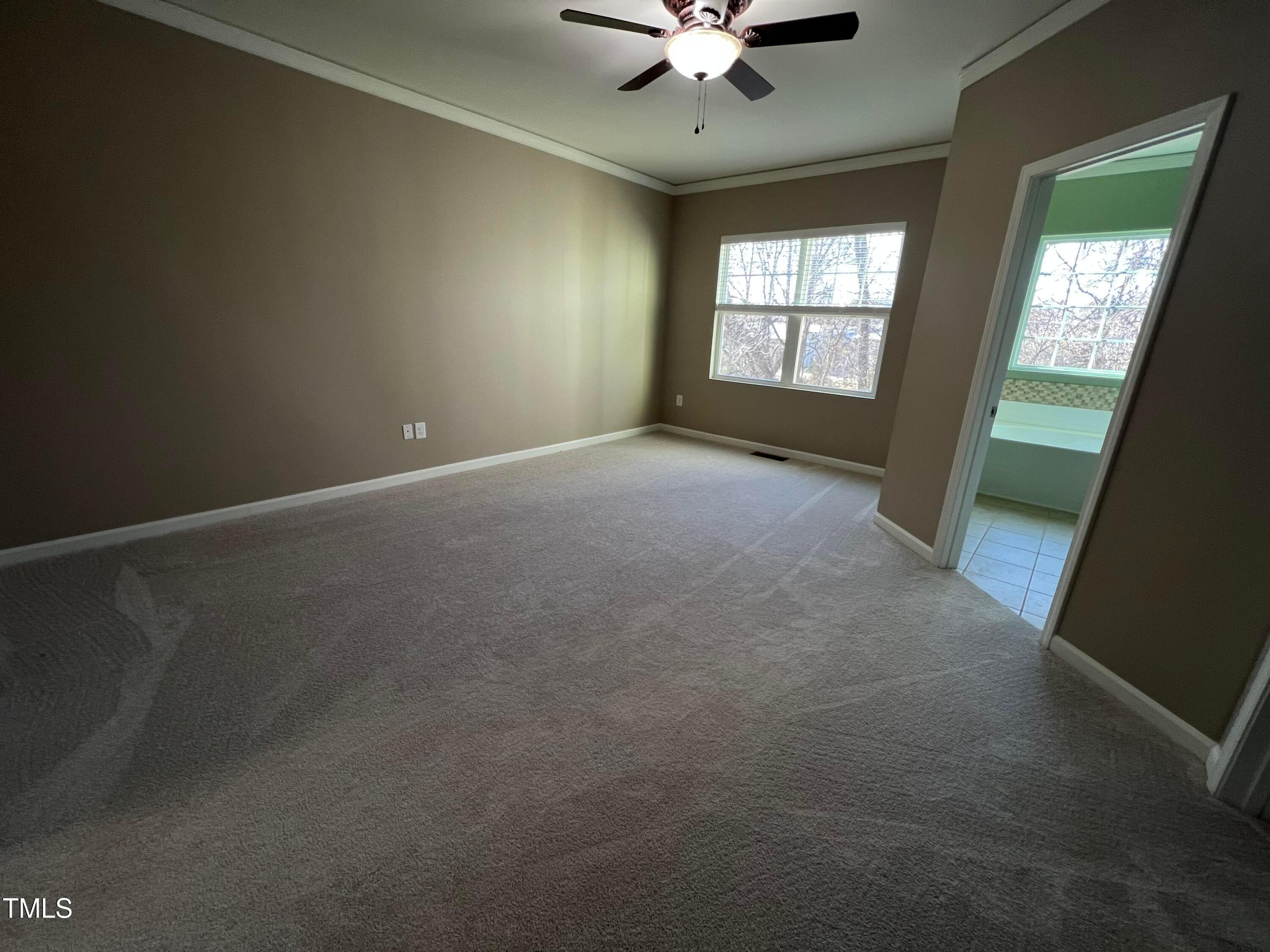 714 Treviso Lane Apex, NC 27502 - Photo 15 of 27 a view of an empty room with a window