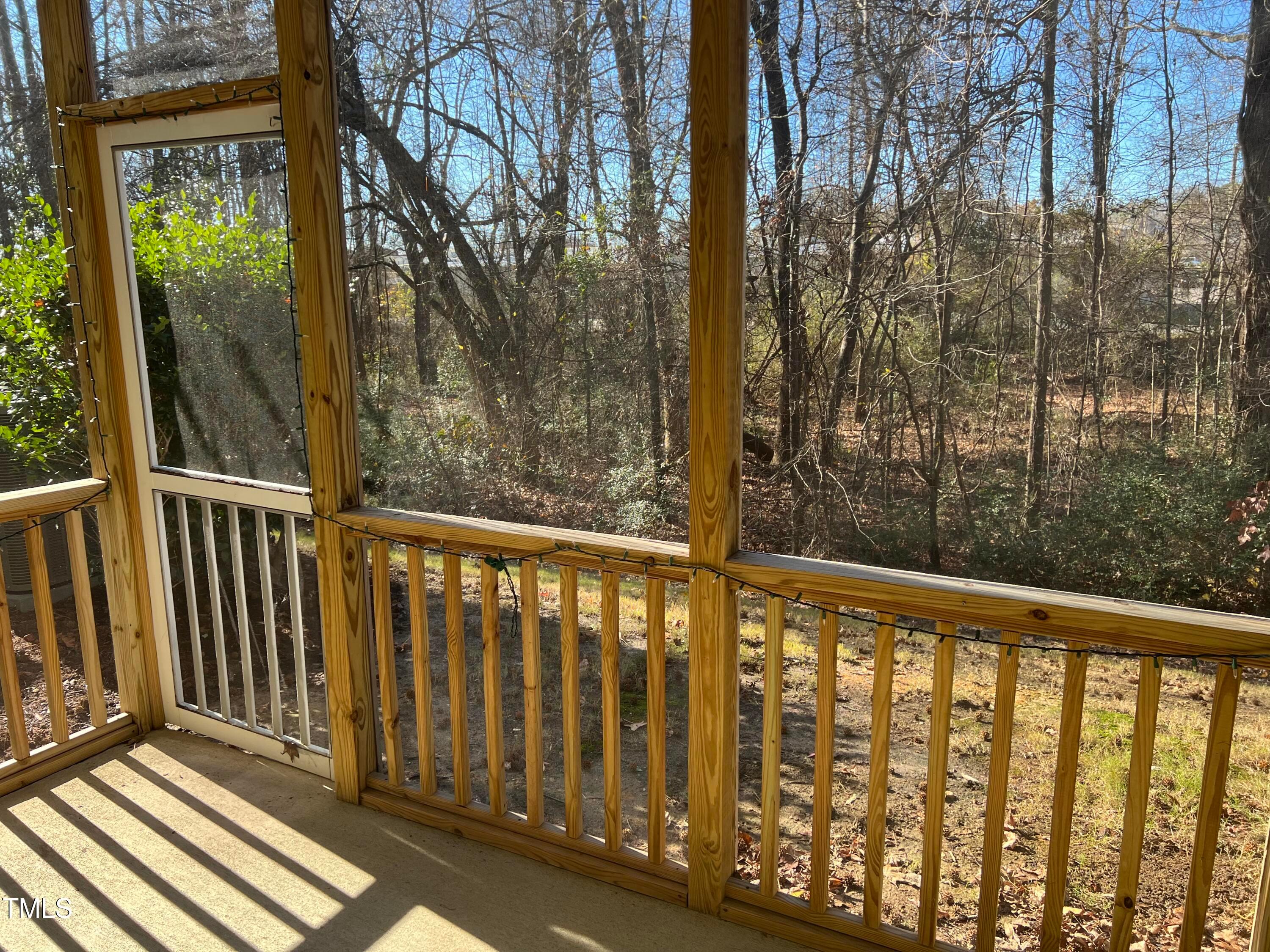 714 Treviso Lane Apex, NC 27502 - Photo 2 of 27 a view of a balcony with wooden floor