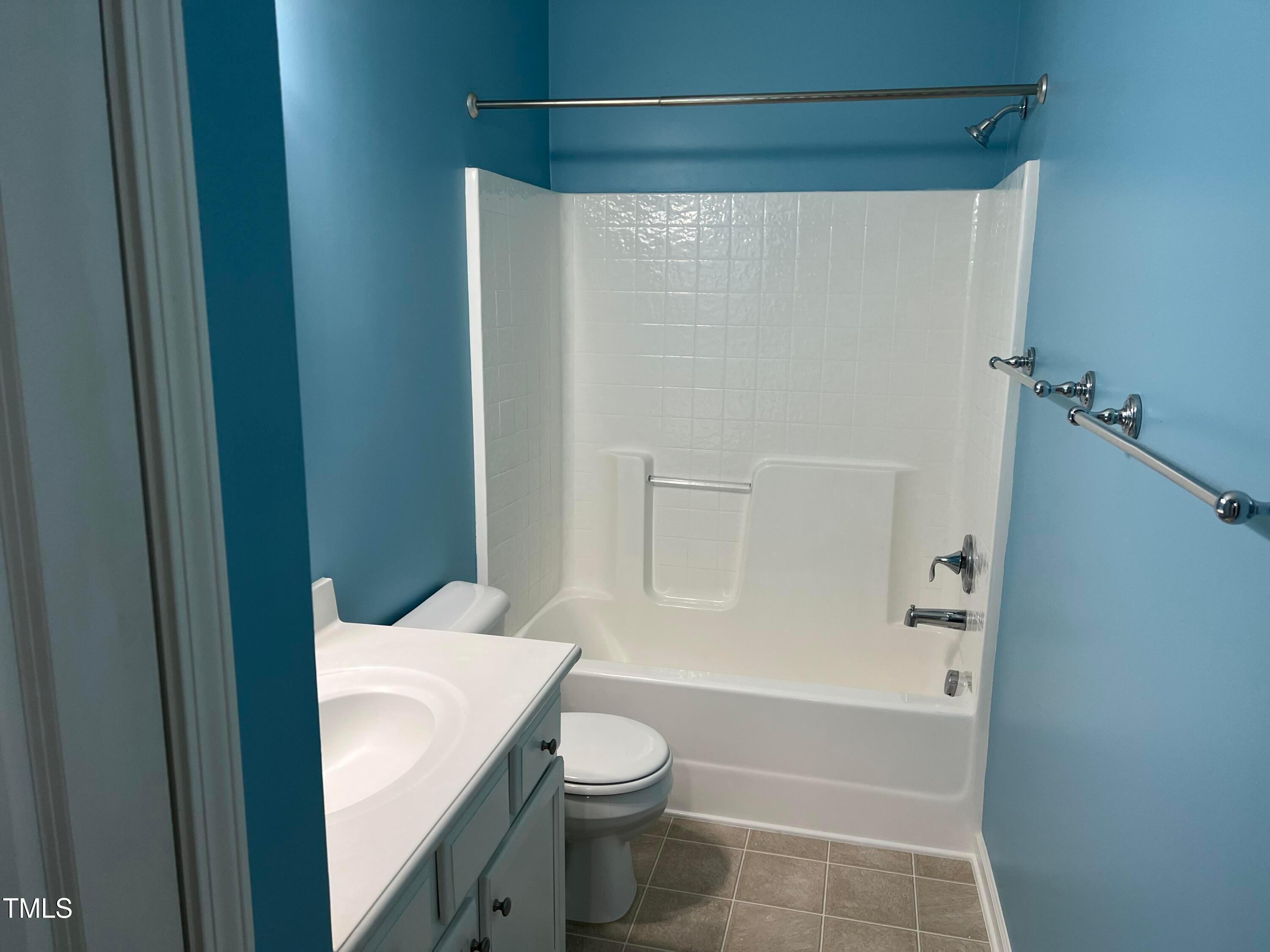 714 Treviso Lane Apex, NC 27502 - Photo 22 of 27 a bathroom with a sink a toilet and shower
