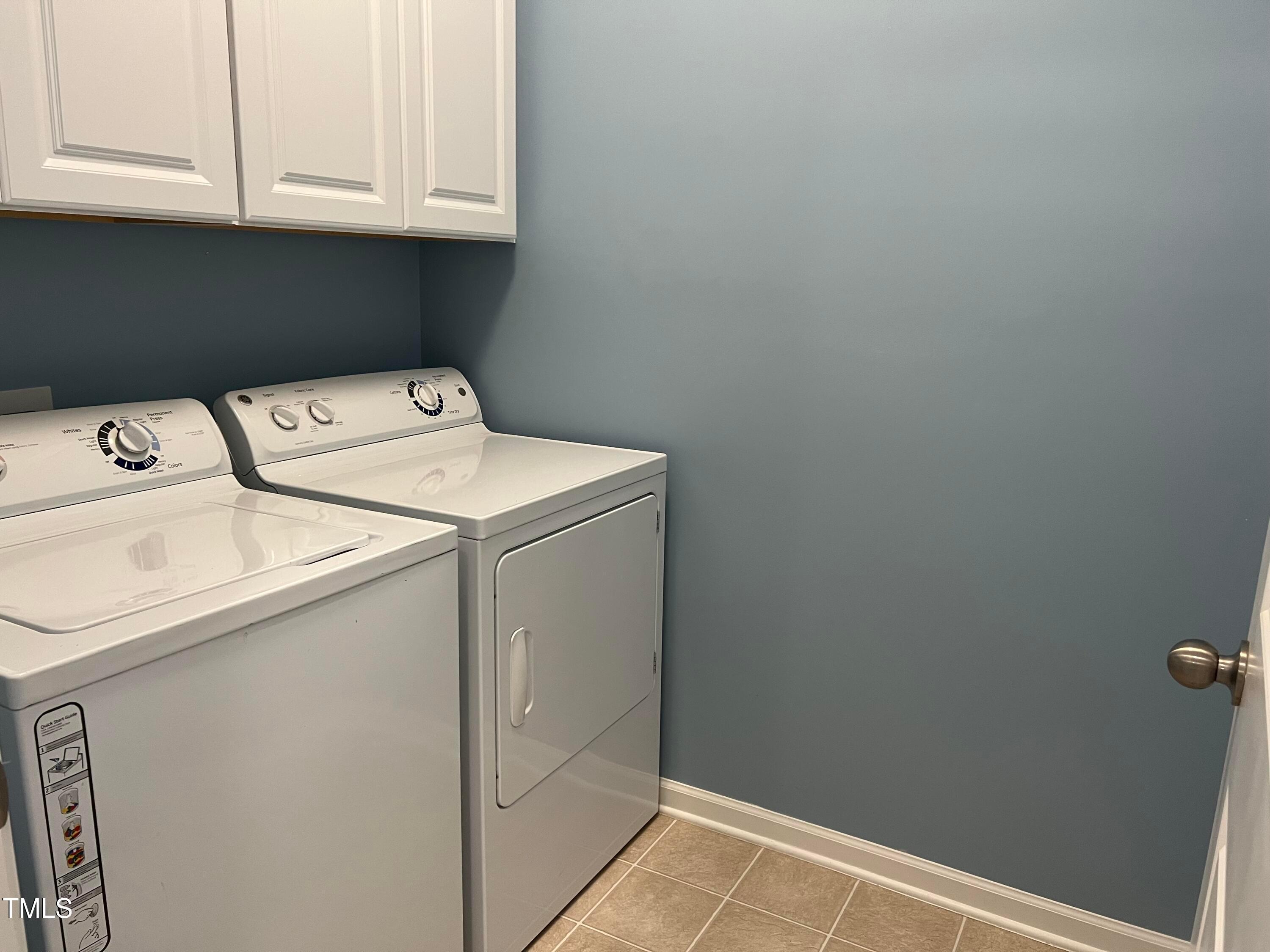 714 Treviso Lane Apex, NC 27502 - Photo 25 of 27 a utility room with dryer and washer