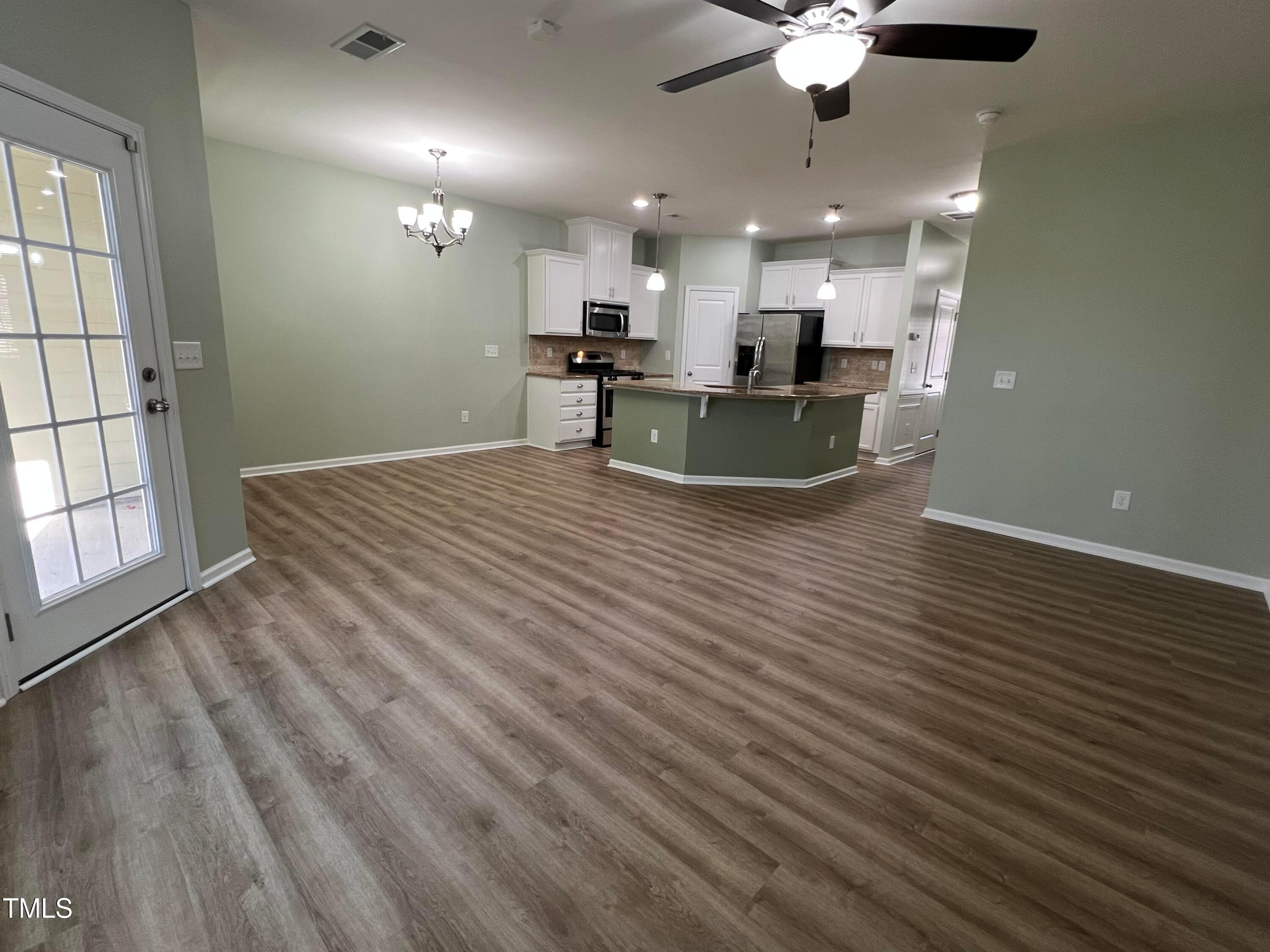 714 Treviso Lane Apex, NC 27502 - Photo 10 of 27 a view of kitchen and windows