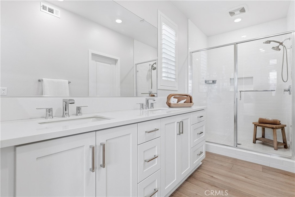 75 Gander Court Rancho Mission Viejo, CA 92694 - Photo 22 of 75 a spacious bathroom with a double vanity sink a mirror a shower and a bathtub