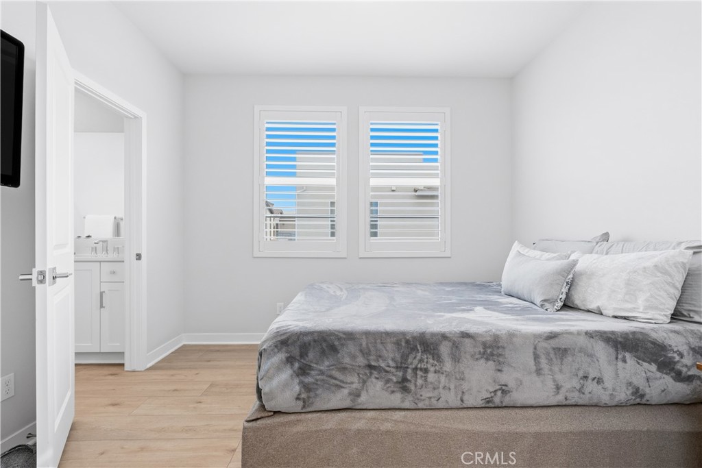 75 Gander Court Rancho Mission Viejo, CA 92694 - Photo 23 of 75 a bedroom with a large bed and wooden floor