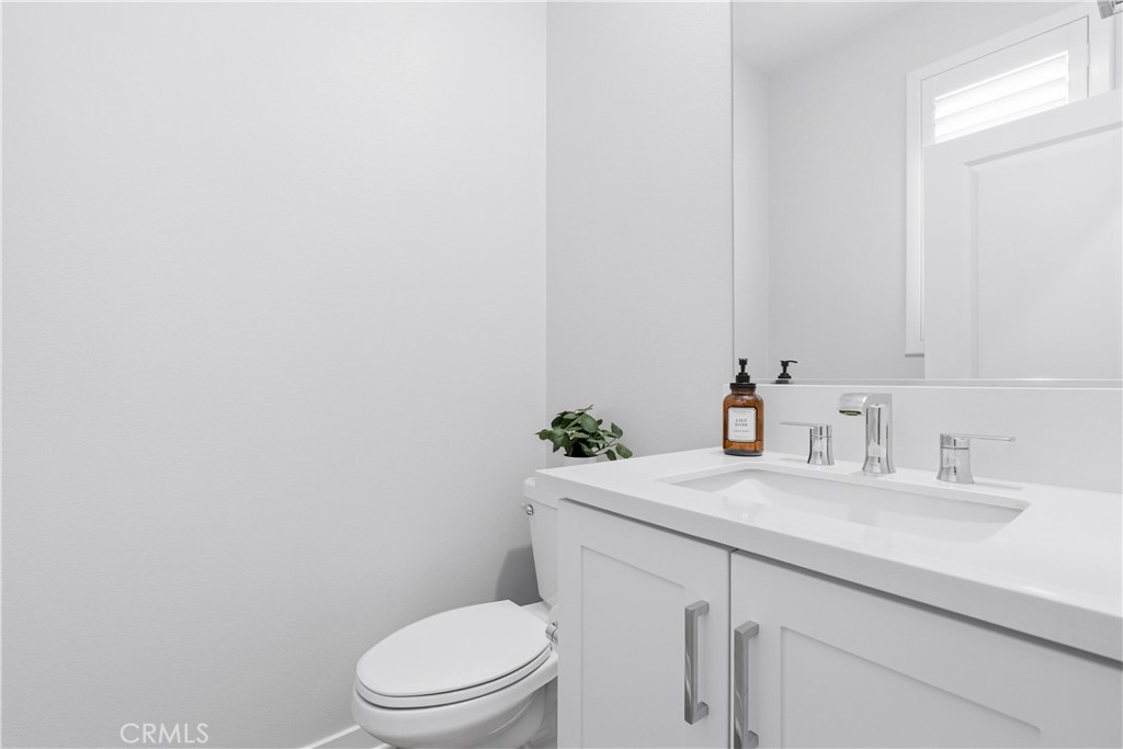 75 Gander Court Rancho Mission Viejo, CA 92694 - Photo 31 of 75 a bathroom with a granite countertop toilet sink and mirror