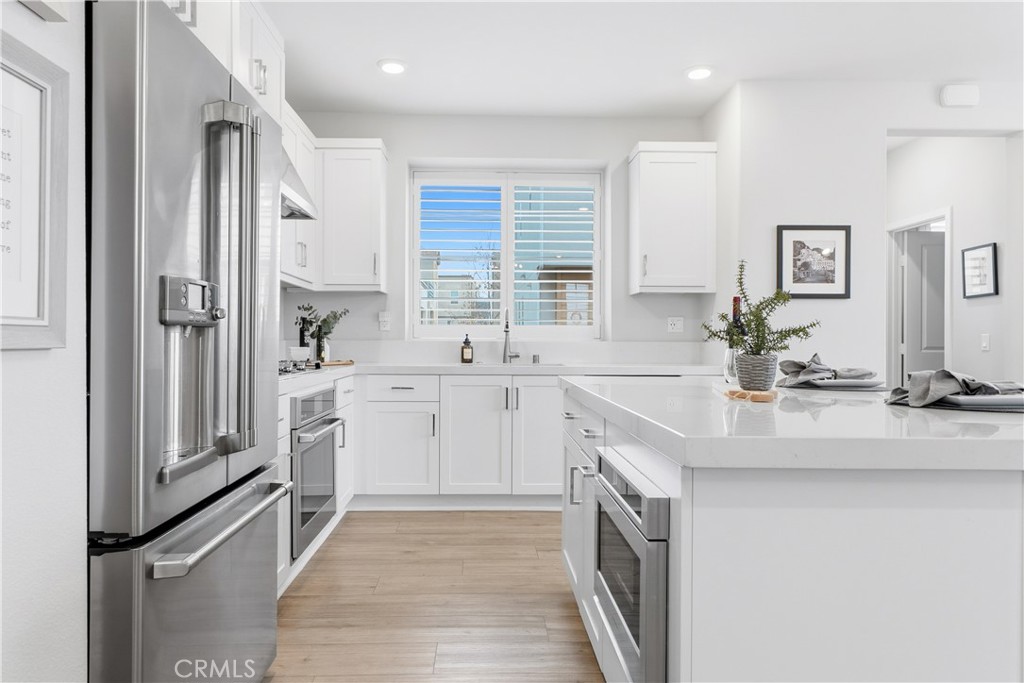 75 Gander Court Rancho Mission Viejo, CA 92694 - Photo 5 of 75 a kitchen with a sink stove and refrigerator