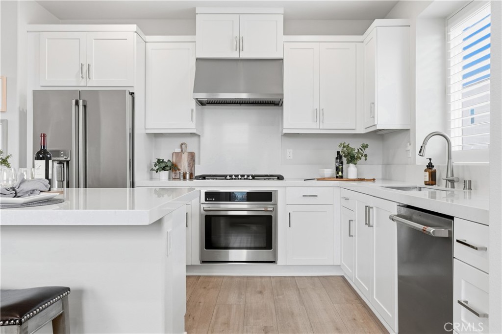 75 Gander Court Rancho Mission Viejo, CA 92694 - Photo 10 of 75 a kitchen with stainless steel appliances granite countertop a sink stove and refrigerator