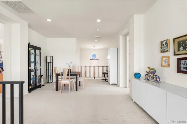a view of a hallway with a balcony