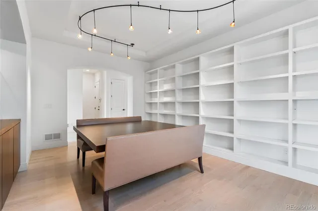 a living room with a furniture and a book shelf
