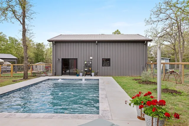 a view of a porch with furniture and a yard