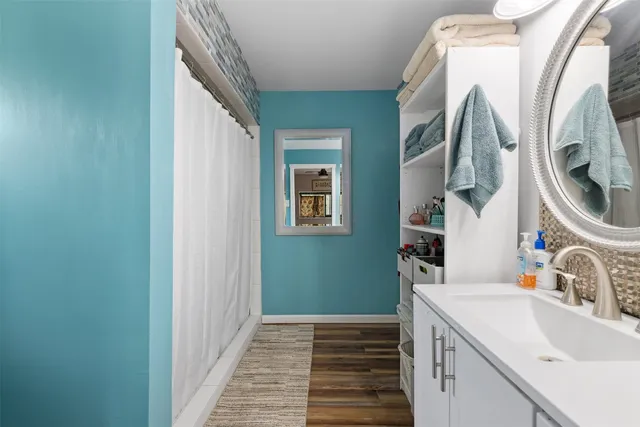 a bathroom with a sink and a mirror