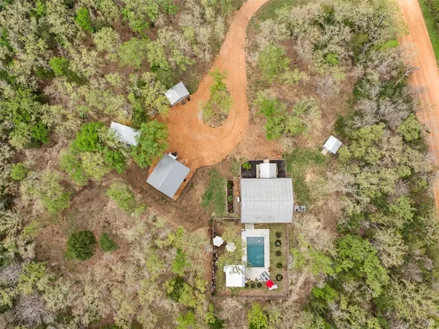 front view of a house with a yard and trees