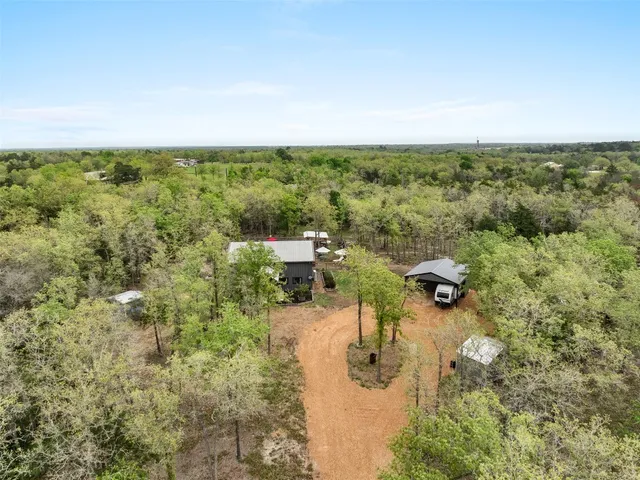 an aerial view of residential house with outdoor space